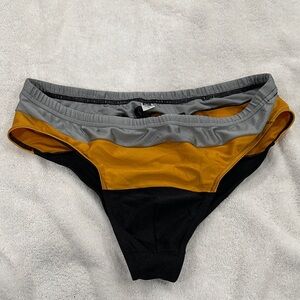 N2N Bodywear Men's Swim Briefs in Gold, Gray, and Black